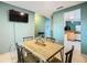 Bright dining room with modern table set, open to other living areas with sleek neutral tones at 1515 Oak Hill Trl, Kissimmee, FL 34747