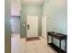 Inviting foyer with tile flooring, neutral paint, and a dark wood console table at 1515 Oak Hill Trl, Kissimmee, FL 34747