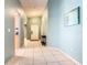 Bright foyer with tile floor leads into the home featuring modern decor and neutral paint at 1515 Oak Hill Trl, Kissimmee, FL 34747