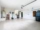 Spacious garage with a washer and dryer, water heater, and ample storage at 1515 Oak Hill Trl, Kissimmee, FL 34747