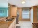 Eat in kitchen featuring white tile floors, granite counters and stainless appliances at 1515 Oak Hill Trl, Kissimmee, FL 34747