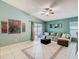 Bright living room with sliding glass doors, cozy gray sofa, and tasteful wall art at 1515 Oak Hill Trl, Kissimmee, FL 34747