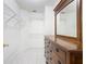 Large walk-in closet with shelving and a dresser with a mirror at 1515 Oak Hill Trl, Kissimmee, FL 34747