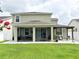 A spacious backyard with a screened-in porch and pergola offers outdoor enjoyment at 15230 Evergreen Oak Loop, Winter Garden, FL 34787