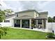 A spacious backyard with a screened-in porch and pergola offers outdoor enjoyment at 15230 Evergreen Oak Loop, Winter Garden, FL 34787