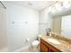 Bathroom featuring a shower/tub combo, a vanity with a granite countertop, and neutral finishes at 15230 Evergreen Oak Loop, Winter Garden, FL 34787