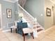 Inviting entryway featuring staircase, stylish decor, and neutral color palette offering a warm and welcoming atmosphere at 15230 Evergreen Oak Loop, Winter Garden, FL 34787