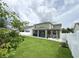 Exterior view showcasing the covered and screened patio and the stone patio at 15230 Evergreen Oak Loop, Winter Garden, FL 34787
