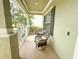 Charming front porch with cozy seating, perfect for relaxing and enjoying the neighborhood views at 15230 Evergreen Oak Loop, Winter Garden, FL 34787