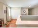 Upstairs hallway featuring hardwood floors, closet, and neutral paint at 15230 Evergreen Oak Loop, Winter Garden, FL 34787