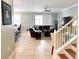 Open concept living room with tile flooring, comfortable seating, and abundant natural light at 15230 Evergreen Oak Loop, Winter Garden, FL 34787
