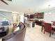 Bright, open-concept space includes a seamless living area, kitchen, and dining space at 15230 Evergreen Oak Loop, Winter Garden, FL 34787