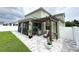 View of the patio with a pergola and string lights, ideal for outdoor relaxation at 15230 Evergreen Oak Loop, Winter Garden, FL 34787