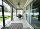 Screened patio offering a covered dining area and access to the backyard at 15230 Evergreen Oak Loop, Winter Garden, FL 34787