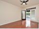 Bedroom featuring wood floors and a sliding glass door leading to the outdoors at 193 Longview Ave # 203, Celebration, FL 34747
