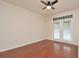 Bright bedroom with wood floors and a sliding glass door leading to the outdoors at 193 Longview Ave # 203, Celebration, FL 34747