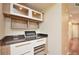 Stylish coffee bar with granite countertop and storage, perfect for coffee enthusiasts and entertaining at 193 Longview Ave # 203, Celebration, FL 34747