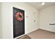 Welcoming entrance with decorative wreath on dark door, creating a warm and inviting first impression at 193 Longview Ave # 203, Celebration, FL 34747