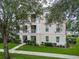 Inviting multi-level exterior featuring beautiful landscaping and charming balconies, ideal for relaxed outdoor enjoyment at 193 Longview Ave # 203, Celebration, FL 34747