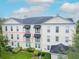 Spacious multi-story building with black awnings and well-maintained landscaping, perfect for comfortable living at 193 Longview Ave # 203, Celebration, FL 34747