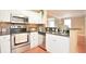 Modern kitchen featuring stainless steel appliances, granite counters, and mosaic backsplash, ideal for culinary enthusiasts at 193 Longview Ave # 203, Celebration, FL 34747