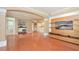 Spacious living room with entertainment center, coffee bar, and archway, perfect for entertaining and relaxation at 193 Longview Ave # 203, Celebration, FL 34747