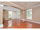 Open living room with hardwood floors, archway and neutral paint, creating an inviting space at 193 Longview Ave # 203, Celebration, FL 34747
