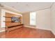 Comfortable living room featuring modern entertainment center and textured wall, ideal for relaxing and entertaining at 193 Longview Ave # 203, Celebration, FL 34747