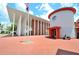 View of the post office on a sunny day with a red brick plaza and an American flag at 193 Longview Ave # 203, Celebration, FL 34747