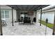 Inviting outdoor space featuring a cozy pergola, patio furniture, and stylish pavers, ideal for relaxation and entertaining at 1940 Egret Meadows Ave, Kissimmee, FL 34744