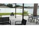 Well-maintained backyard featuring a pergola, fire pit, patio seating, and decorative palm trees, creating a private oasis at 1940 Egret Meadows Ave, Kissimmee, FL 34744