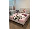 Bedroom with bright decor and a plush bed at 1940 Egret Meadows Ave, Kissimmee, FL 34744