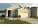 Charming single-story home with a well-manicured lawn and attached two-car garage at 1940 Egret Meadows Ave, Kissimmee, FL 34744