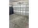 Spacious garage ready for parking and storage with a large garage door, offering ample room at 1940 Egret Meadows Ave, Kissimmee, FL 34744
