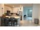 Well-lit kitchen showcasing modern appliances, a breakfast bar with seating, and an open view to the dining area at 1940 Egret Meadows Ave, Kissimmee, FL 34744