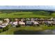 Aerial view of a neighborhood with lake and backyard pools at 1950 Windward Oaks Ct, Kissimmee, FL 34746