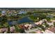Aerial view of a sprawling community with multiple lakes, and lush green spaces at 1950 Windward Oaks Ct, Kissimmee, FL 34746