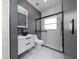 Modern bathroom features contemporary vanity, sleek fixtures, and a glass-enclosed shower, offering a stylish design at 1950 Windward Oaks Ct, Kissimmee, FL 34746