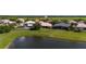 Spacious, well-maintained homes with beautiful landscaping on a large lot with a pond view at 1950 Windward Oaks Ct, Kissimmee, FL 34746