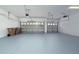 Two car garage features automatic door openers and painted epoxy floors at 1950 Windward Oaks Ct, Kissimmee, FL 34746