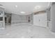 Bright living room boasts marble floors, crown molding, neutral paint, and double door entrance at 1950 Windward Oaks Ct, Kissimmee, FL 34746