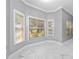 Bright sitting area with marble floors and large windows that provide abundant natural light at 1950 Windward Oaks Ct, Kissimmee, FL 34746