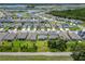 Overhead shot of a community with beautiful lake views and lush green landscaping at 2223 Bluebird Pl, St Cloud, FL 34771