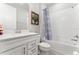 Well-lit bathroom featuring a vanity, toilet, and shower-tub combination at 2223 Bluebird Pl, St Cloud, FL 34771