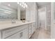 Bathroom featuring double sinks, white cabinetry, and modern fixtures at 2223 Bluebird Pl, St Cloud, FL 34771