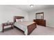 Bedroom with carpet floor, natural light, neutral walls and wood furniture at 2223 Bluebird Pl, St Cloud, FL 34771