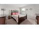 Bedroom with carpet floor, natural light, neutral walls and wood furniture at 2223 Bluebird Pl, St Cloud, FL 34771
