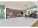 Covered patio with outdoor seating, opens to a spacious living area and kitchen at 2223 Bluebird Pl, St Cloud, FL 34771