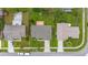 Bird's-eye view showcasing a well-maintained home with a spacious backyard, long driveway, and a two-car garage at 2569 Tandori Cir, Orlando, FL 32837