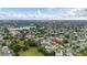 Scenic aerial view displays a community with lush greenery and the home marked in red for easy identification at 2569 Tandori Cir, Orlando, FL 32837